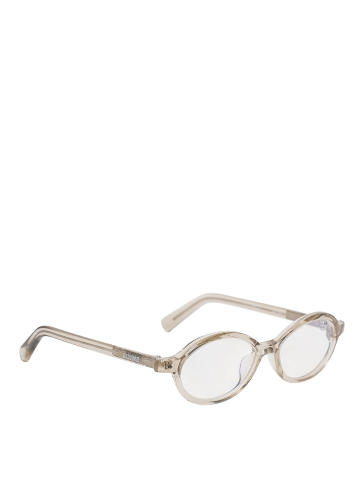 Jacquemus Pablo oval optical glasses with a translucent champagne acetate frame and clear lenses, front view - view 2