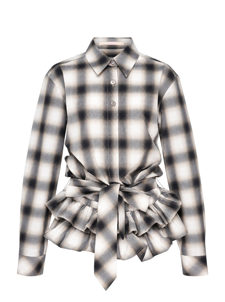Sultry Virgin plaid tie-waist ruffle shirt in ombre charcoal and ivory check, featuring a point collar, button-front, long sleeves, and voluminous gathered ruffle hem with trailing tie detail