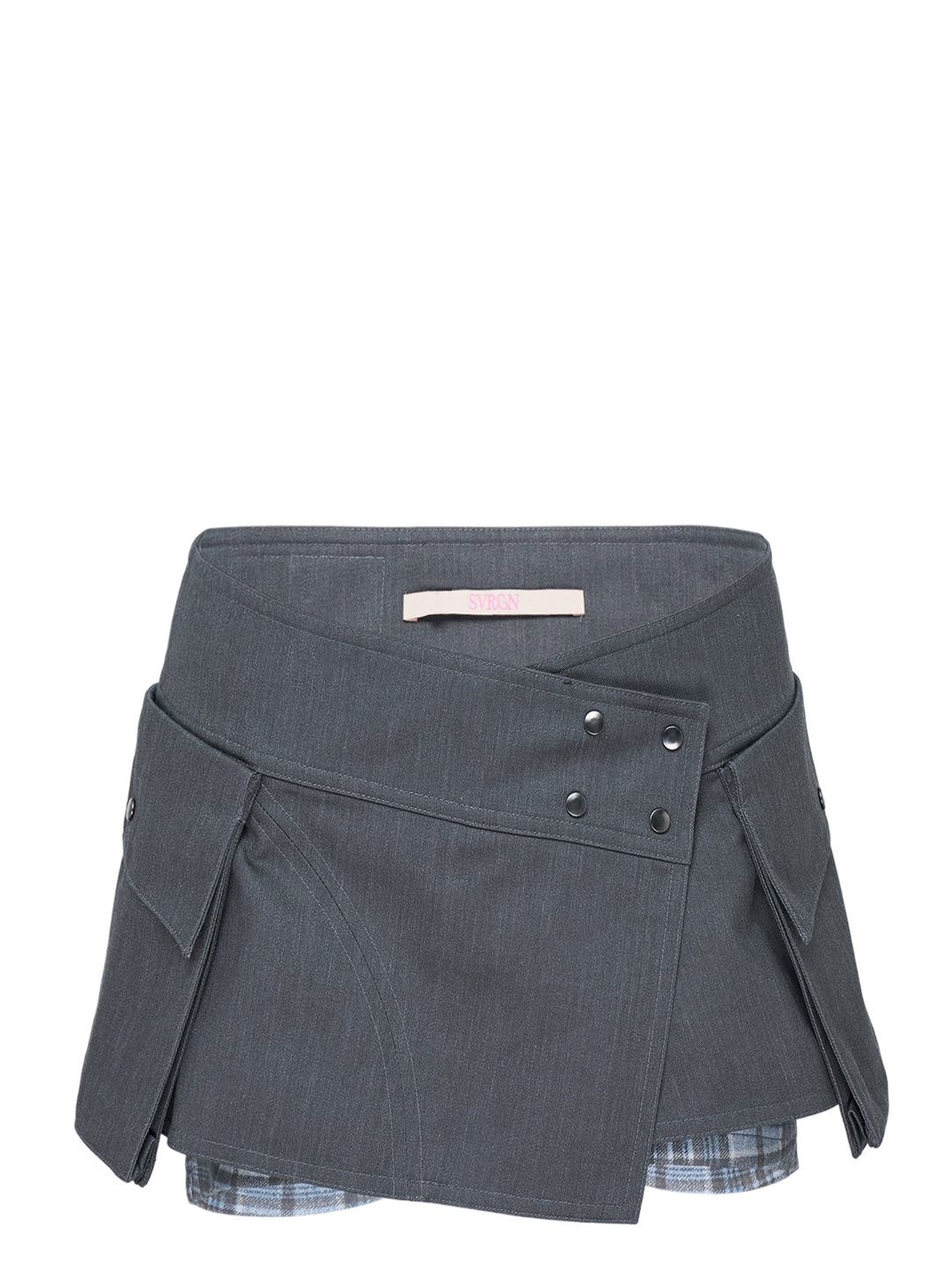 Sultry Virgin Utility Cargo Skort in grey suiting fabric, featuring a crossover wrap waistband with snap buttons, layered pleated panels, cargo pocket detailing, and a plaid underlay at the hem