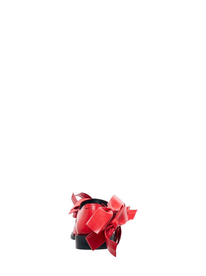 Pair of Phileo Mary Jane Bows flats in red leather with oversized sculptural bows and buckle strap on a black sole - view 3