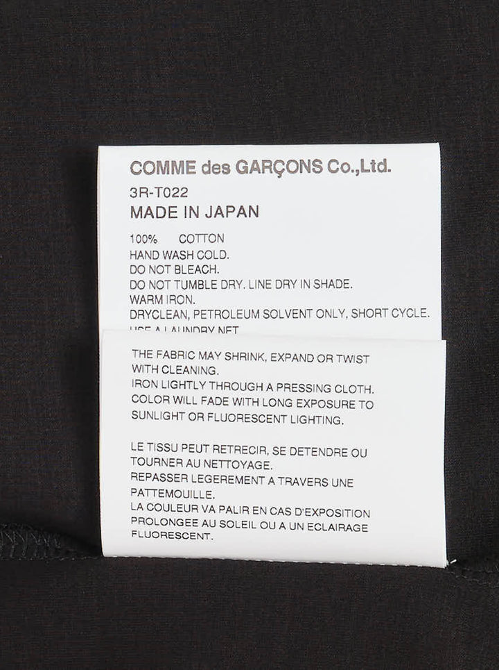 Noir Kei Ninomiya black cotton ponte tee with three dimensional bow appliqués and star-cut panels cascading diagonally down the front - view 4