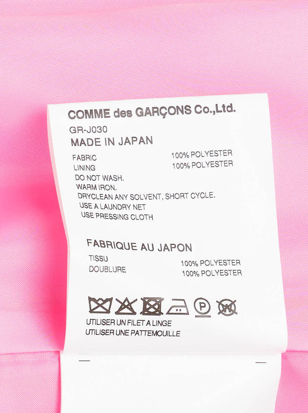 Comme des Garçons hot pink satin single-breasted blazer with large cascading gathered ruffle appliqués across the front, four cream buttons, and a notched lapel, product flat lay on white background - view 3