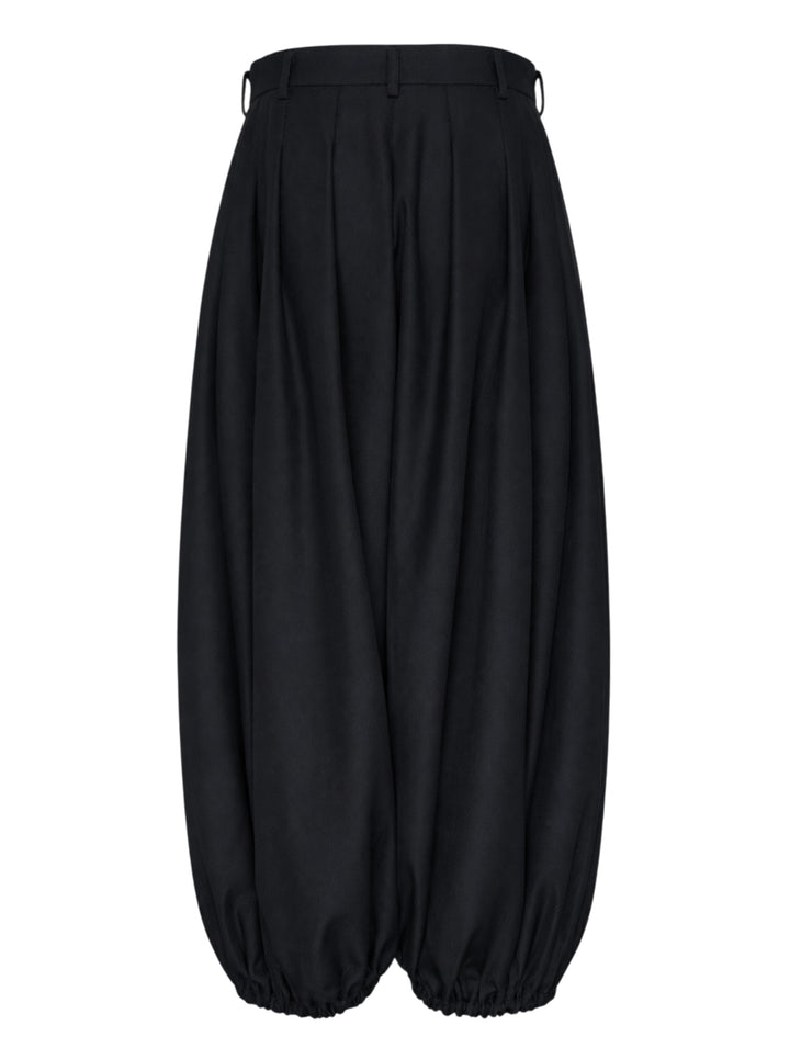 Comme des Garçons black balloon trousers with pleated high waist, voluminous silhouette, and elasticated gathered hems, shot flat on white background - view 2