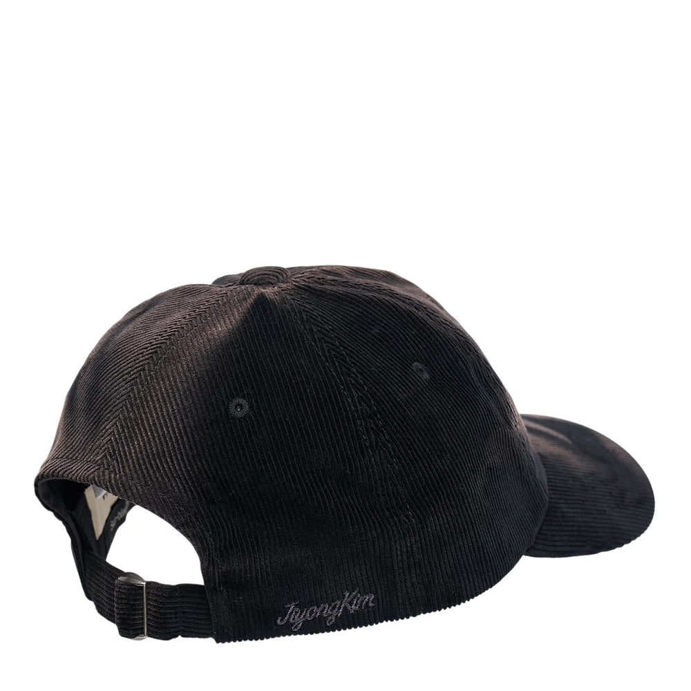 JiyongKim Sun-Bleached Ball Cap in black corduroy with fine ribbed texture and six-panel unstructured construction, front view - view 2