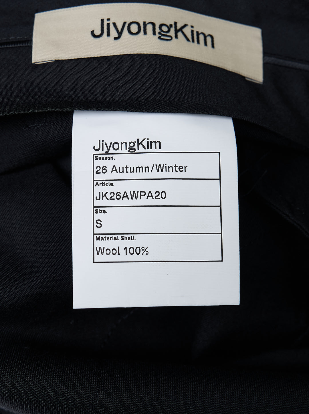JiyongKim black Layered Panel Trousers with draped buttoned panel and sculpted side volume, shown from the front - view 5