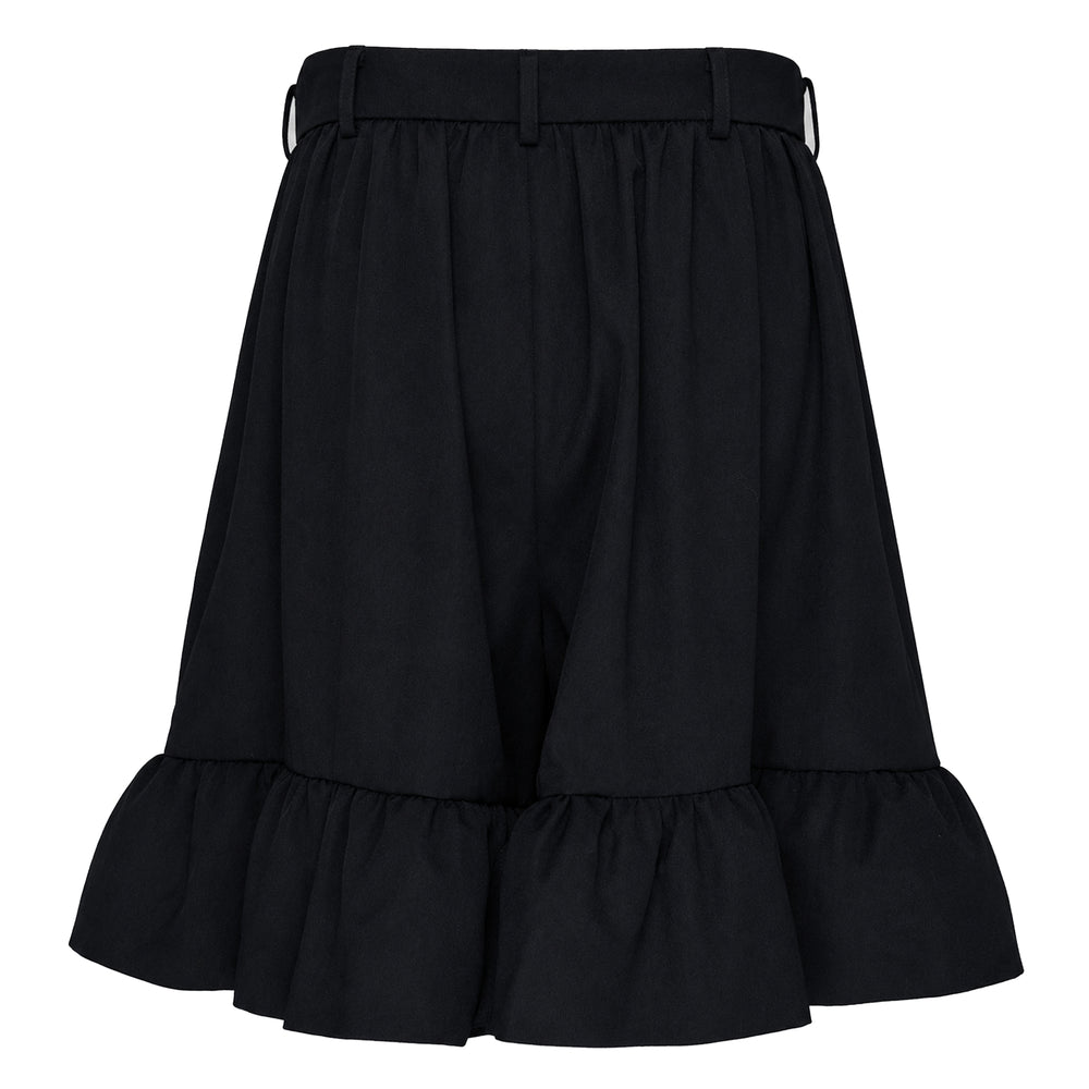 Comme des Garçons Girl black wide-leg shorts with high-rise waistband, single button closure, and tiered ruffle hem detail, product flat lay on white background