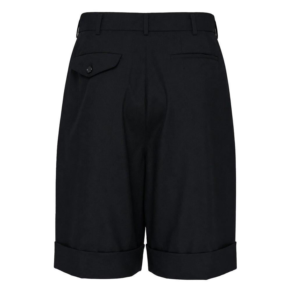 Comme des Garçons Girl black tailored wide-leg shorts with double pleats, high waist, and turned-back cuffed hem, front view on white background