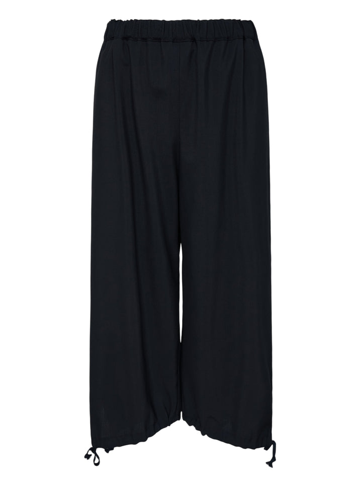 Black cropped wide-leg wool pants with an elasticated waistband and drawstring tie hems by Comme des Garçons Girl