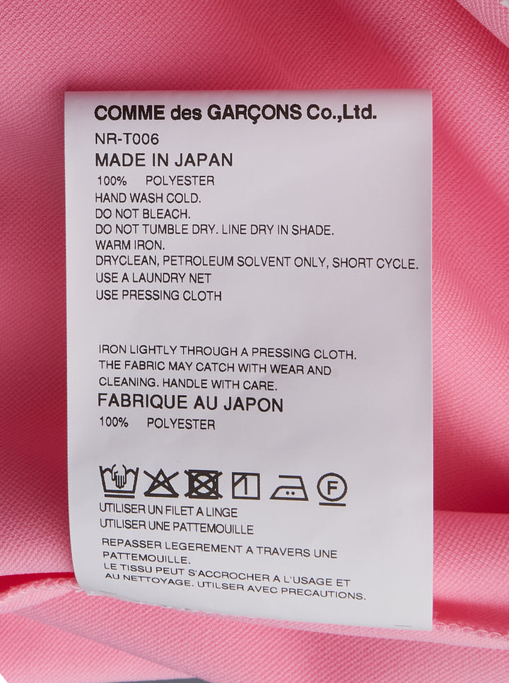 Comme des Garçons Girl pink short sleeve tee with multiple ribbon bows scattered across the chest, relaxed boxy fit with turned-back cuffs and ribbed hem - view 3