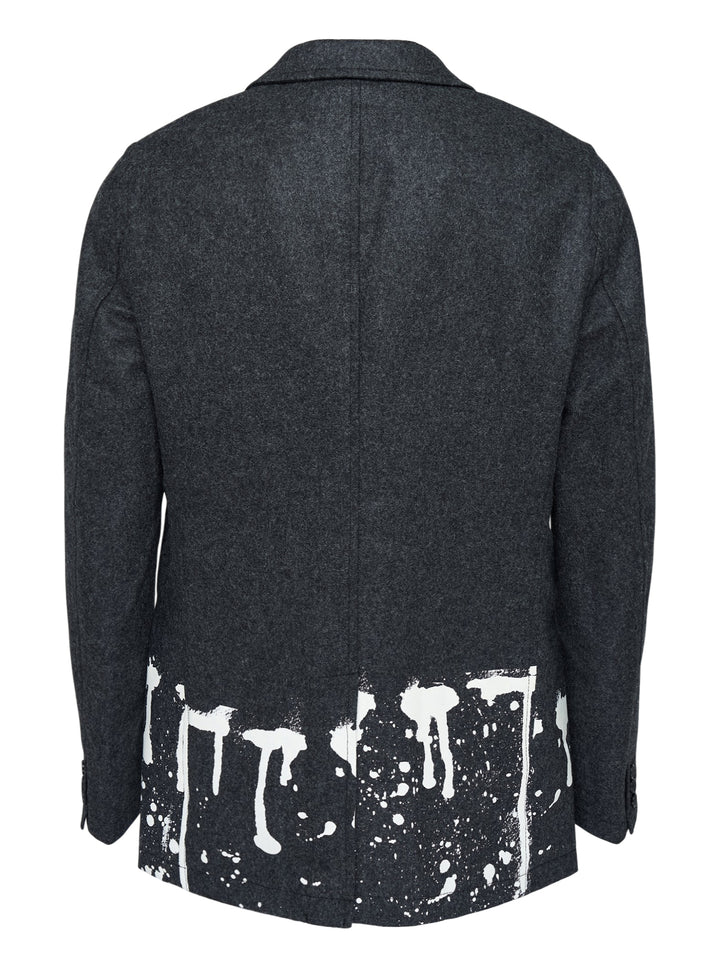 Comme des Garçons Shirt charcoal wool blazer with notched lapels, two-button closure and white paint-drip print along the hem - view 2