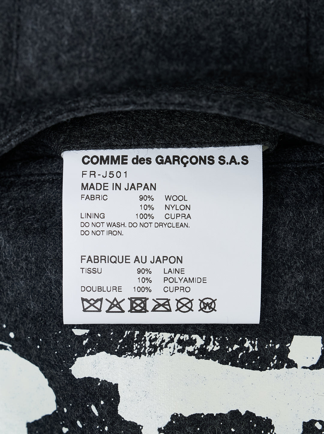 Comme des Garçons Shirt charcoal wool blazer with notched lapels, two-button closure and white paint-drip print along the hem - view 3