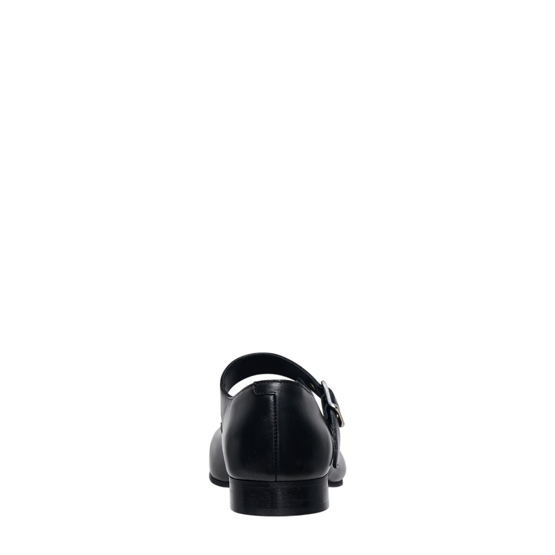 Comme des Garçons Comme des Garçons black leather Mary Jane flat with sculptural round toe and silver buckle instep strap, side profile view - view 3