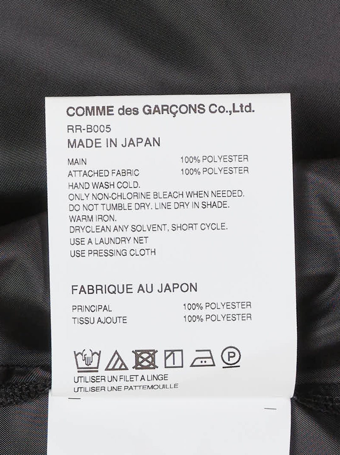 Black layered sheer long-sleeve shirt with pointed collar, white buttons, chest pocket and extended underlayer hem, shown on a white background - view 4