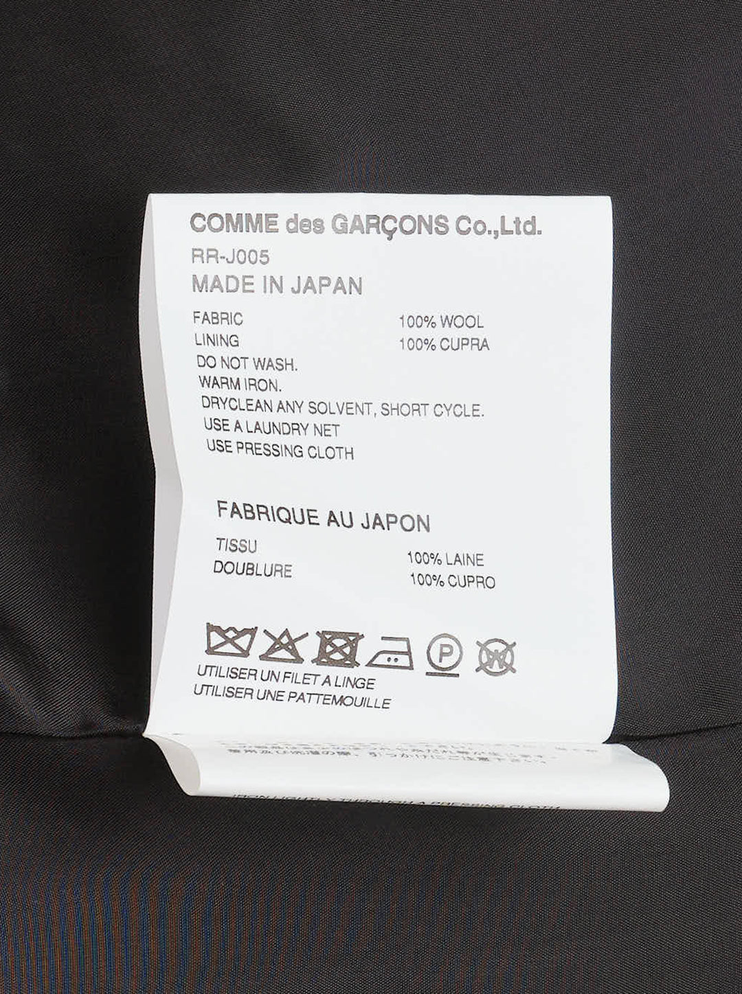 Comme des Garçons Comme des Garçons charcoal grey single-breasted tailored blazer with deconstructed double-lapel detail and three-button closure, styled flat on a white background - view 3