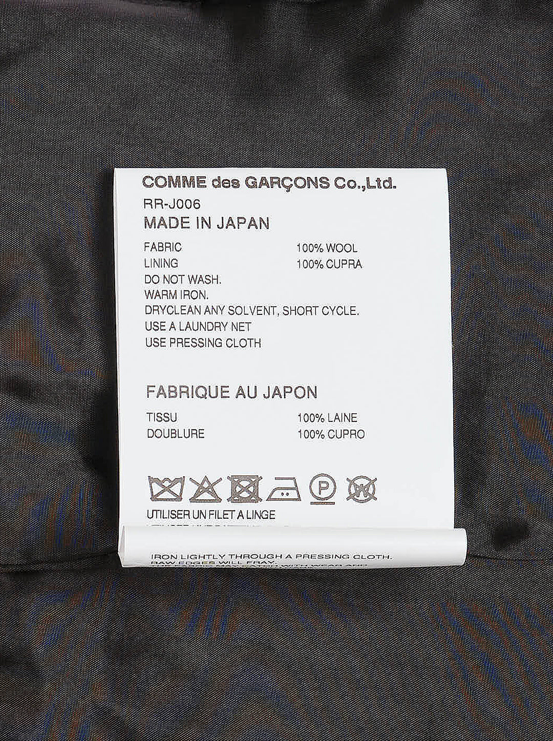 Comme des Garçons Comme des Garçons single-breasted tailored blazer in mid-grey mélange wool, featuring notched lapels, three-button closure, chest welt pocket, and twin flap hip pockets, shown flat on a white background. - view 3