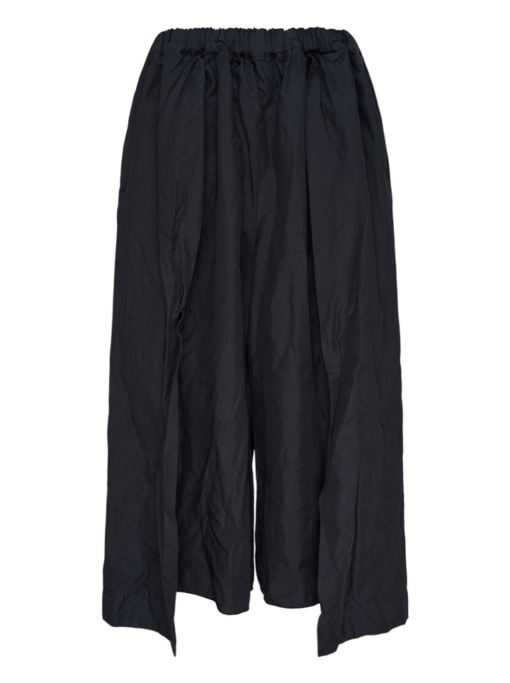 Comme des Garçons Comme des Garçons relaxed wide leg black drawstring pants with elasticated waistband and voluminous crinkled drape, shown flat on white background