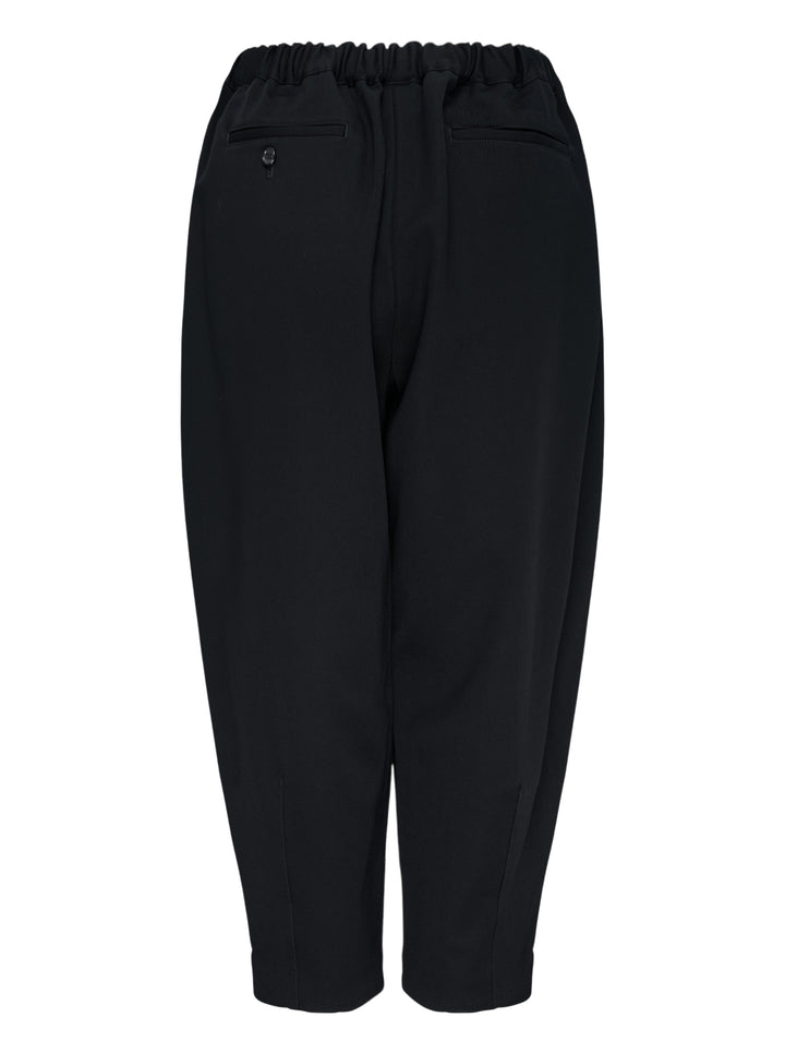 Comme des Garçons Comme des Garçons black tapered cocoon pants with elasticated ruched waistband and cropped narrow hem, front view - view 2