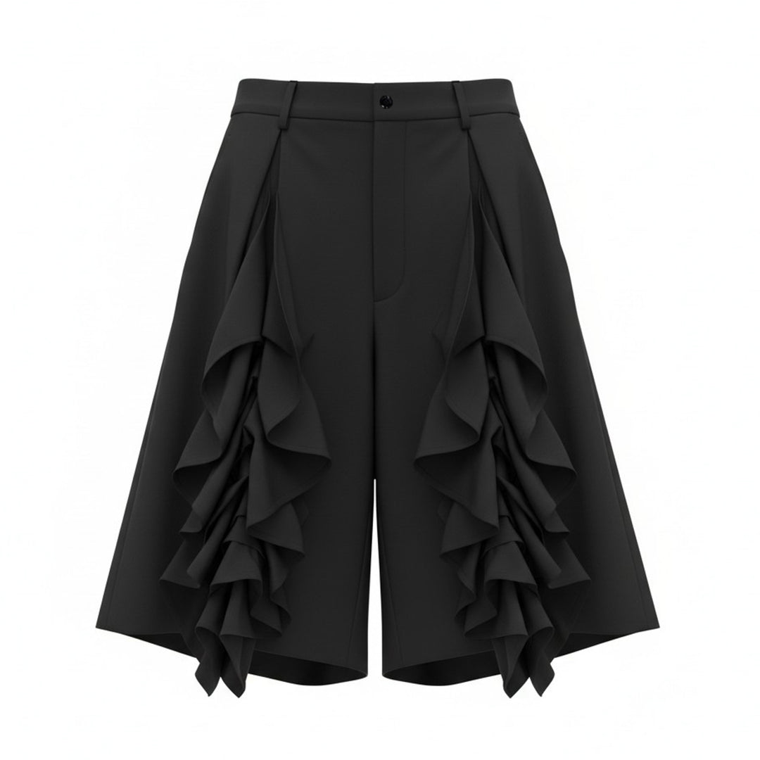 Comme des Garçons Homme Plus black wool tropical wide-leg shorts with cascading ruffle panels on the front, high-rise waistband with belt loops and single button fastening, on a white background