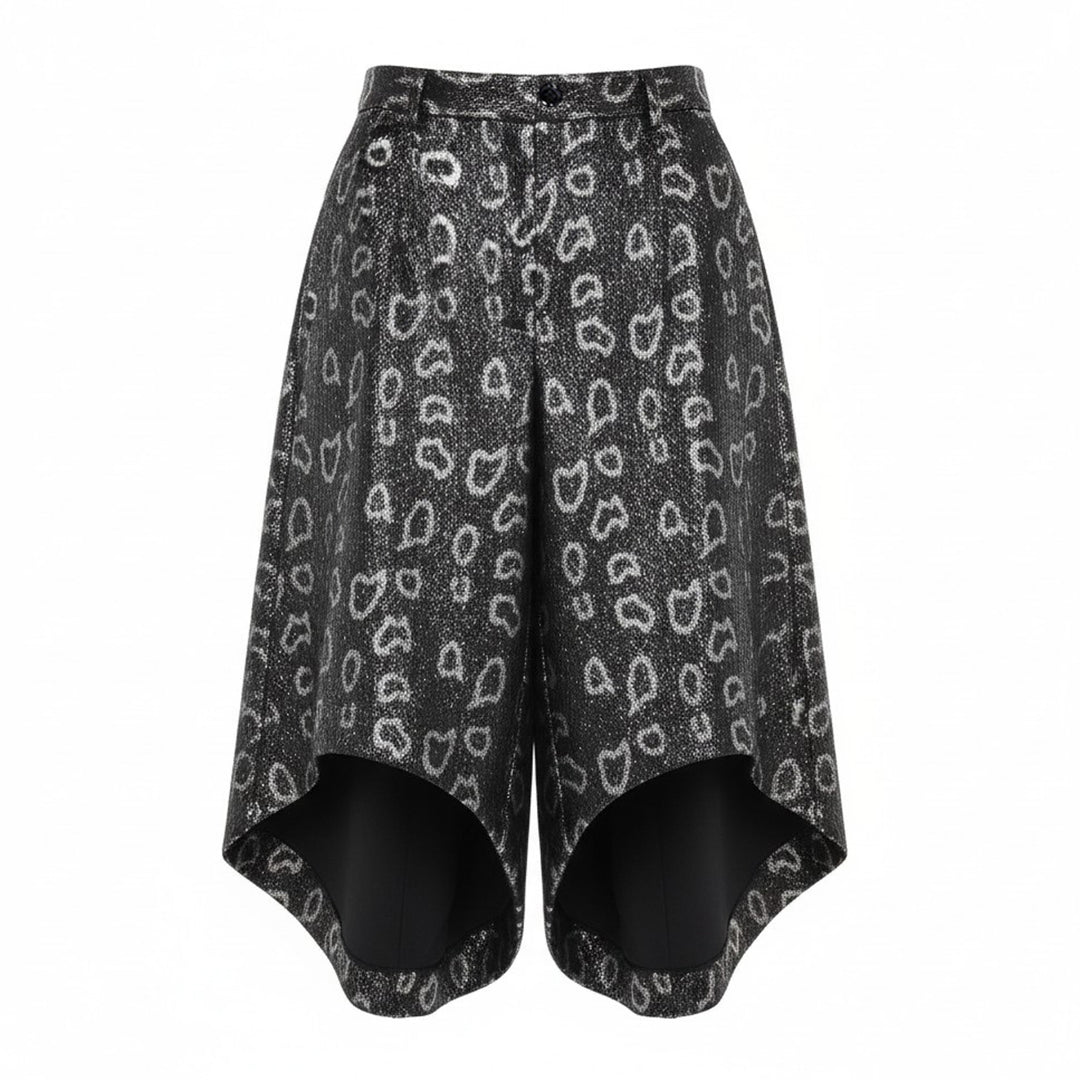 Comme des Garçons Homme Plus wide-leg pants in dark metallic polyester jacquard with an allover open-heart print and dramatically flared curved hem