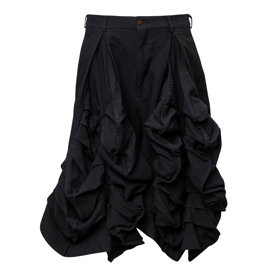 Comme des Garçons Homme Plus garment-dyed black polyester serge shorts with dramatic ruched ruffle detailing and structured waistband, front view