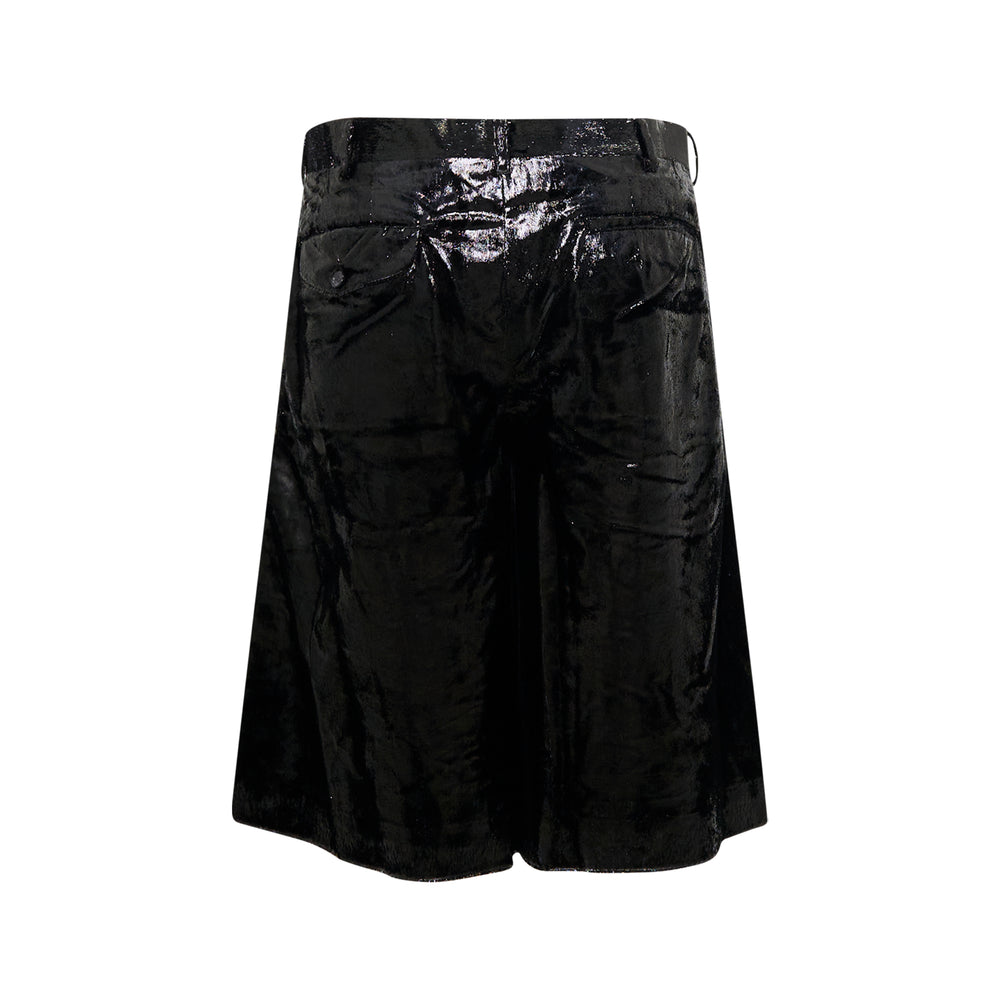 Comme des Garçons Homme Plus black crushed velvet pleated shorts with structured waistband and deep inverted pleats, knee-length silhouette on white background - view 2