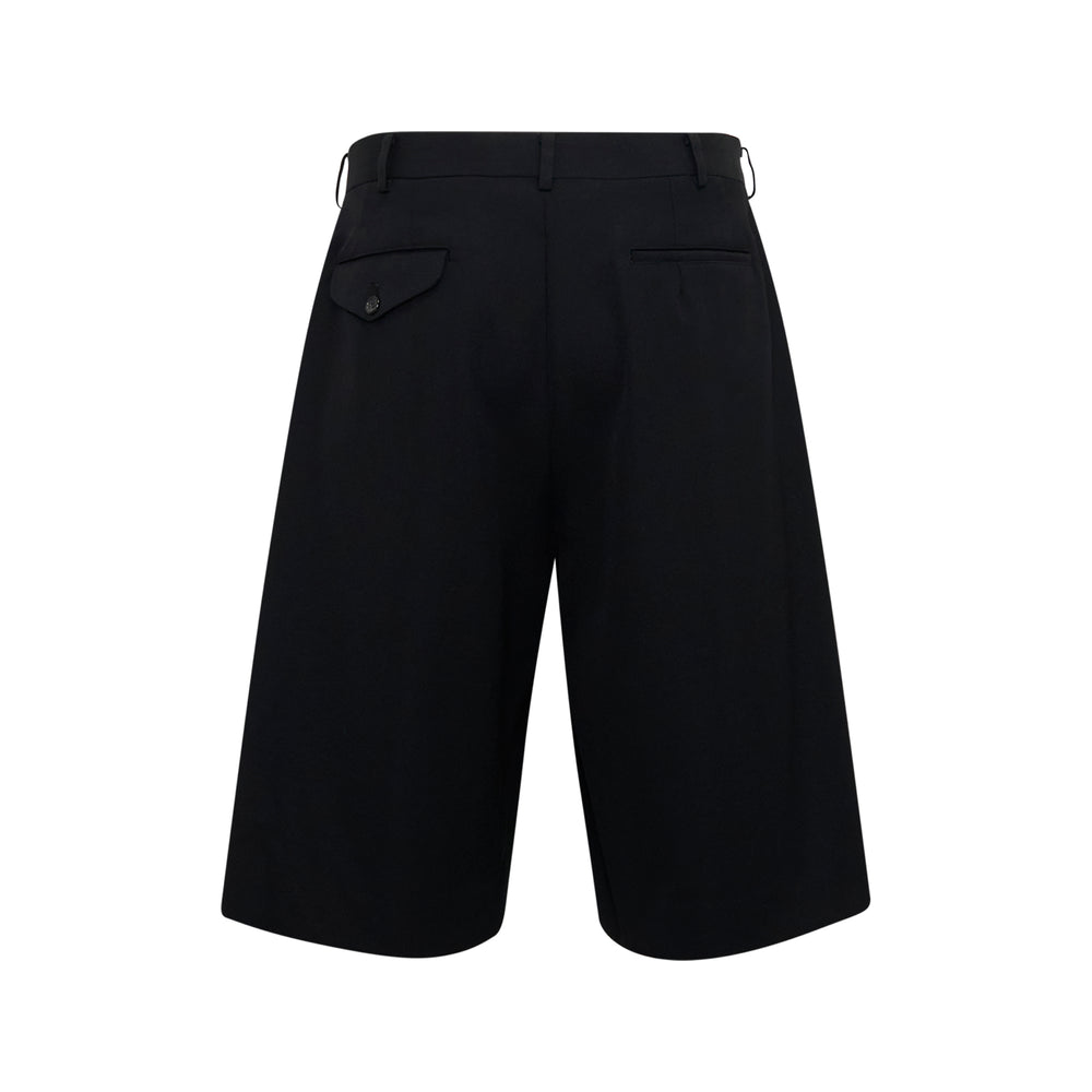 Comme des Garçons Homme Plus black wool gabardine pleated shorts with wide-leg silhouette and high-rise waistband, shot on white background - view 2