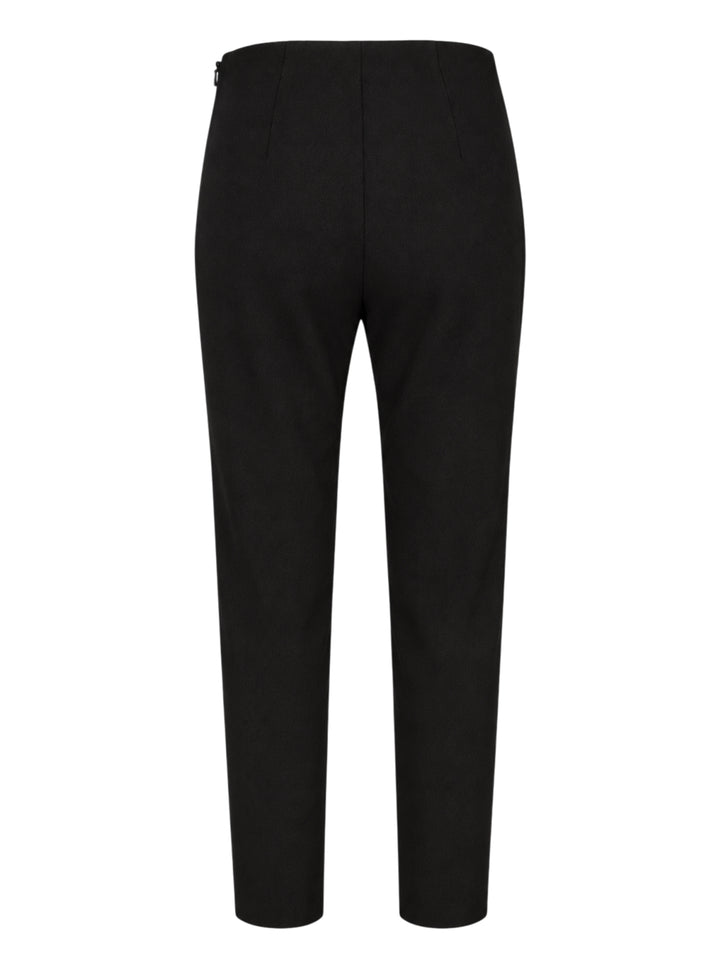 Black slim-fit cigarette pants by Carolina Herrera with a high-rise waist and ankle-length tapered leg, shown from the front - view 2