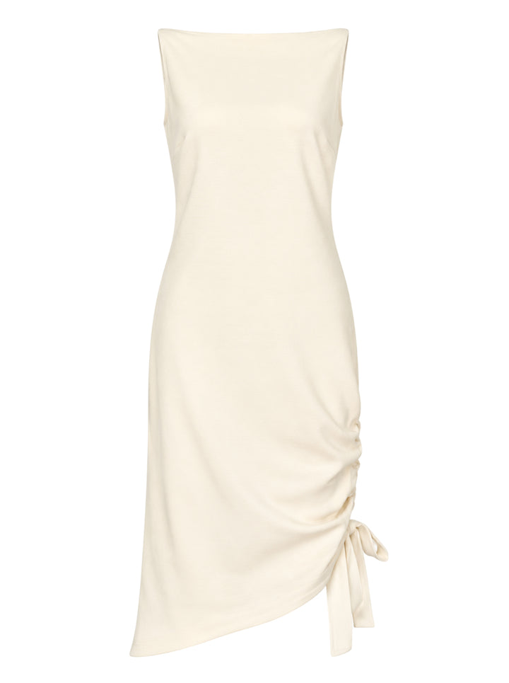 Carolina Herrera ivory sleeveless boatneck midi dress with ruched asymmetrical hem and self-tie bow detail, displayed flat on white background