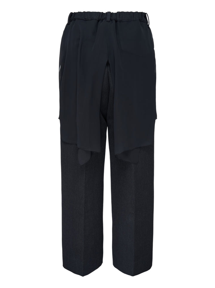 Undercover layered trousers in black and charcoal with a sheer overlay panel and straight-leg cut, front view - view 2