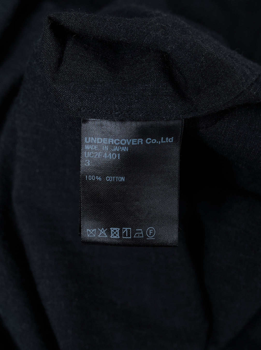 Undercover Two Pocket Long Sleeve Shirt in black with point collar, front button placket and two chest pockets with frayed openings - view 3