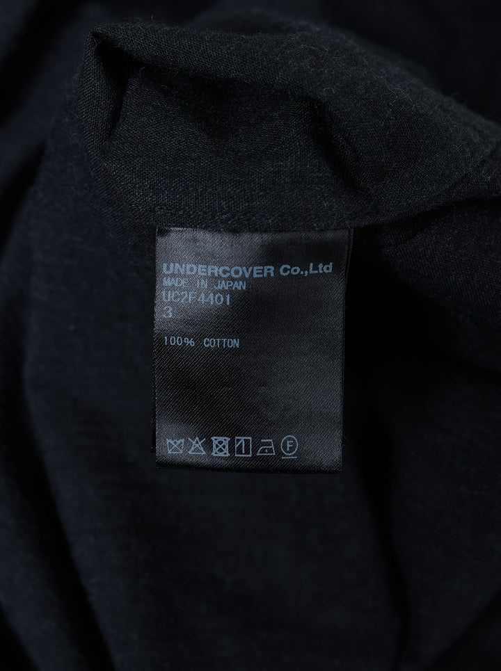 Undercover Two Pocket Long Sleeve Shirt in black with point collar, front button placket and two chest pockets with frayed openings - view 3