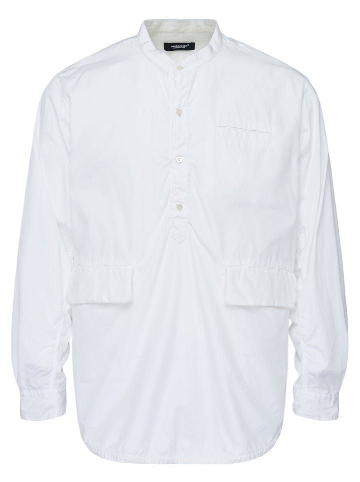 Undercover white long sleeve pullover shirt with band collar, half-button placket, and two flap pockets at the waist