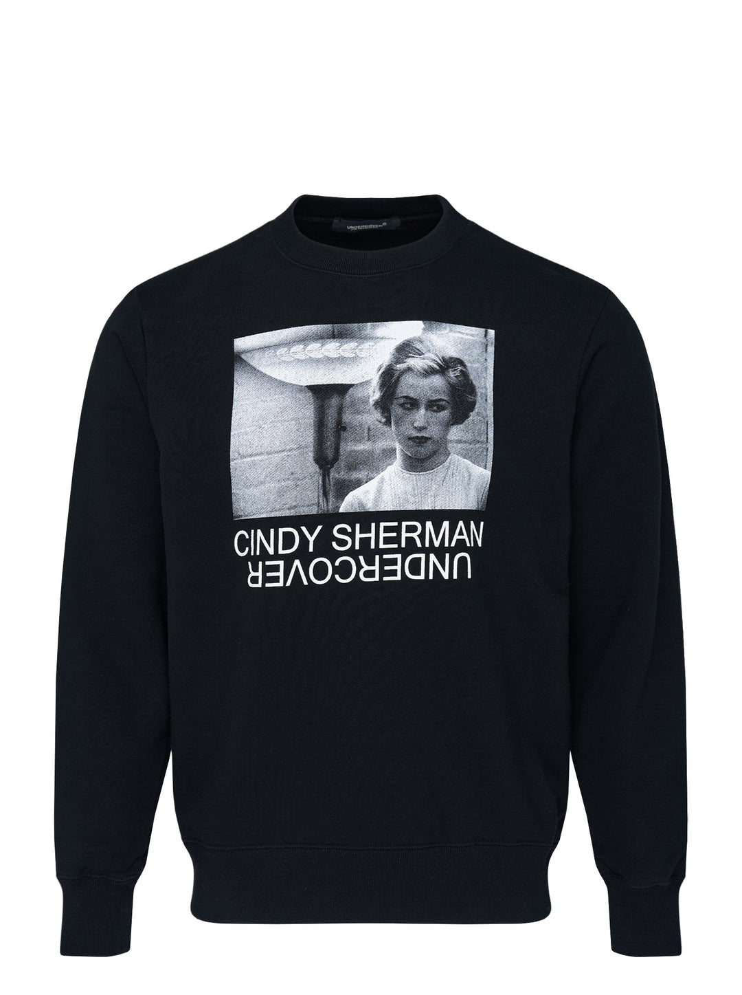 Undercover x Cindy Sherman black crewneck sweatshirt with a monochrome photographic print of a woman and mirrored Undercover logo on the chest