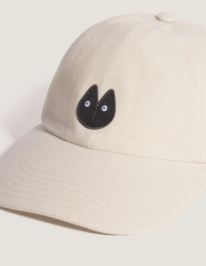 Maison Kitsuné Fortune Fox Cap in cream with an embroidered black fox head patch on the front and a curved brim - view 3