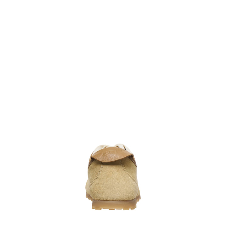 Jacquemus Les Tennis suede sneaker in sandy beige with cream flat laces, leather heel tab, and a gum rubber outsole, shown in profile - view 3