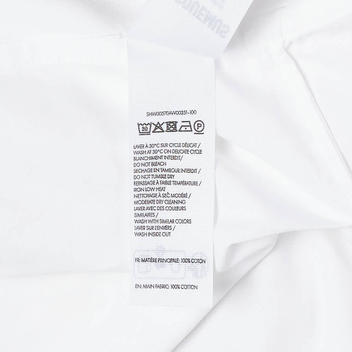Jacquemus La Chemise Citta white woven button-down shirt with spread collar, long sleeves, and tonal buttons on a white background - view 4