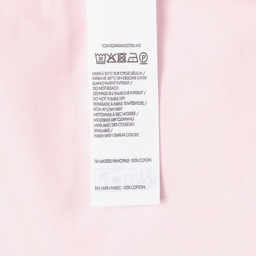 Jacquemus La Haut Drap sleeveless woven top in pale pink with structured shoulder seams, side zip detail, and navy brand label at the neckline - view 3