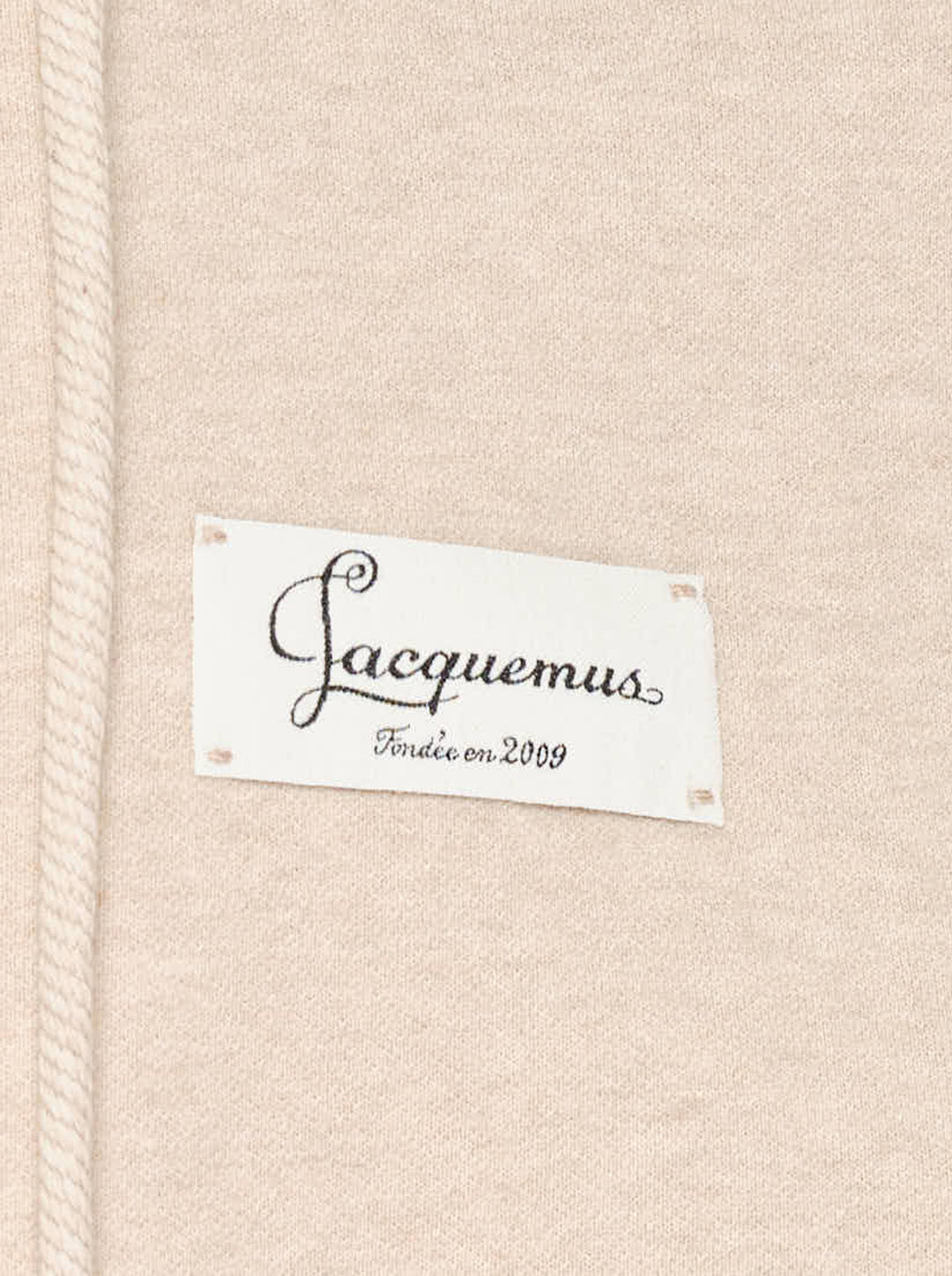Jacquemus Montaigne oversized zip-up hoodie in beige with drawstring hood, ribbed cuffs and woven chest label - view 3