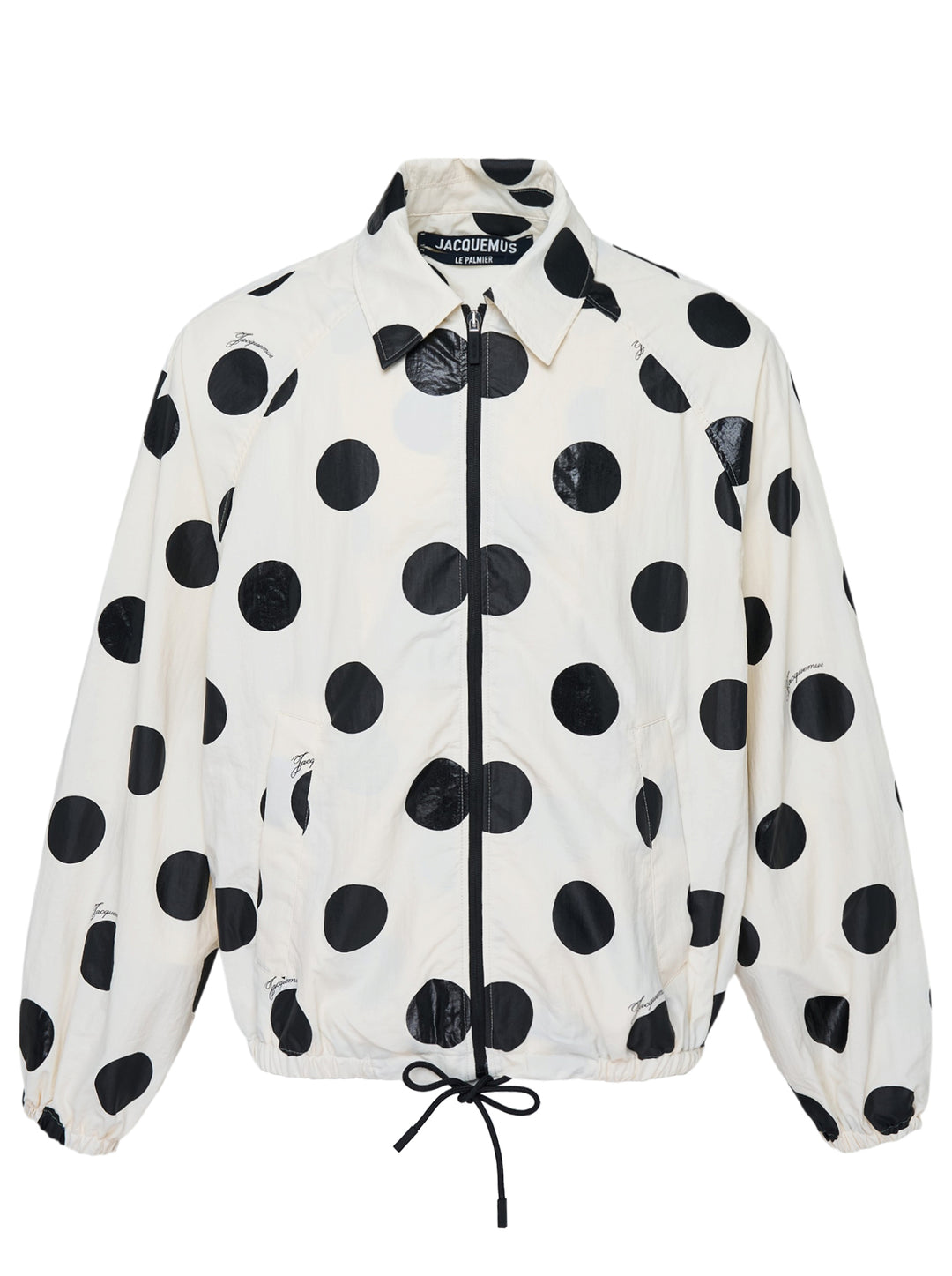 Jacquemus Le Palmier cream windbreaker jacket with large black polka dots, zip front, collar and drawstring hem