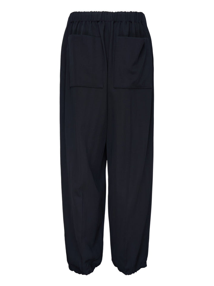 Jacquemus Gio navy trousers with an elasticated waist, relaxed wide leg and gathered cuffs, shown from the front - view 2