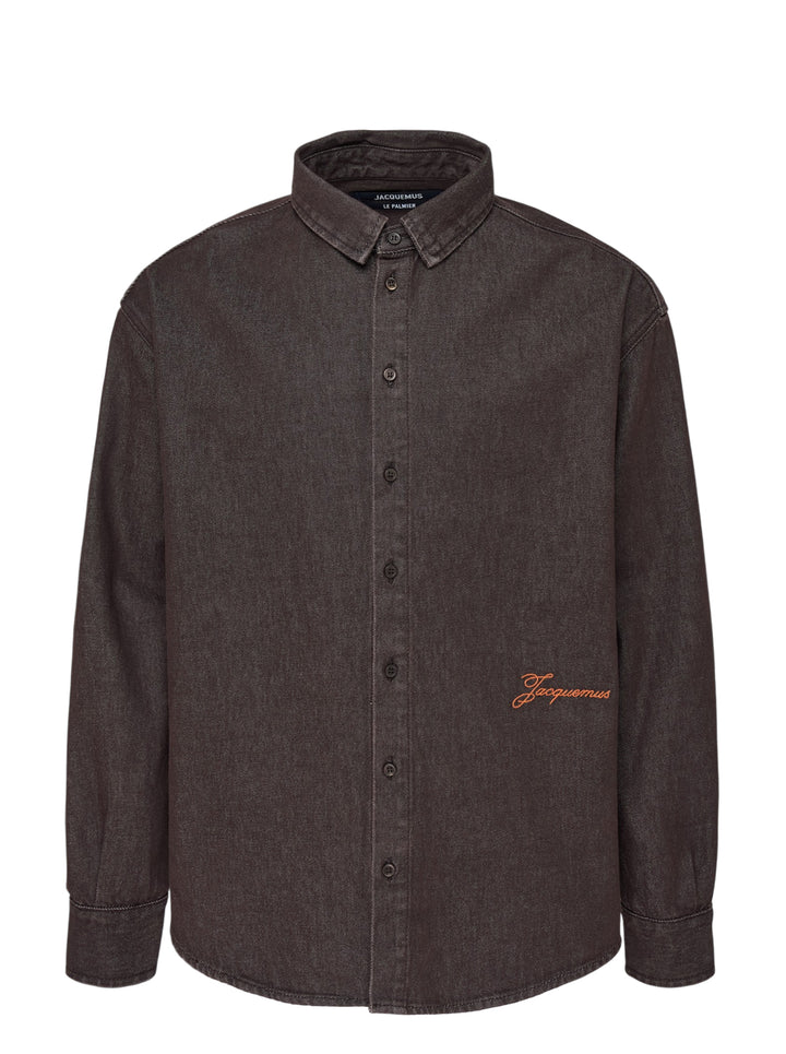 Jacquemus Simon long sleeve denim shirt in washed brown with button-down collar and orange embroidered script logo