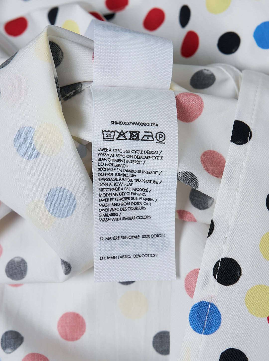 Jacquemus La Chemise Losange long sleeve white shirt with red, blue, yellow, and black polka dot print, front view - view 3