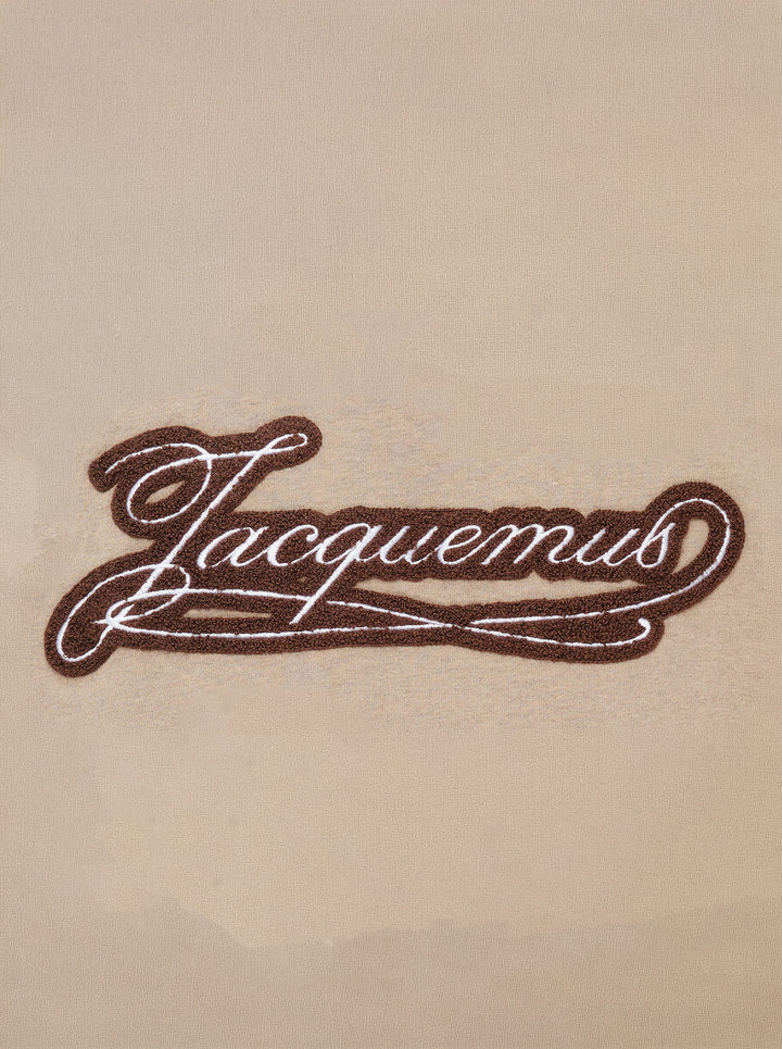 Jacquemus Le T-shirt Torneo short sleeve tee in taupe with a woven botanical label at the hem - view 4