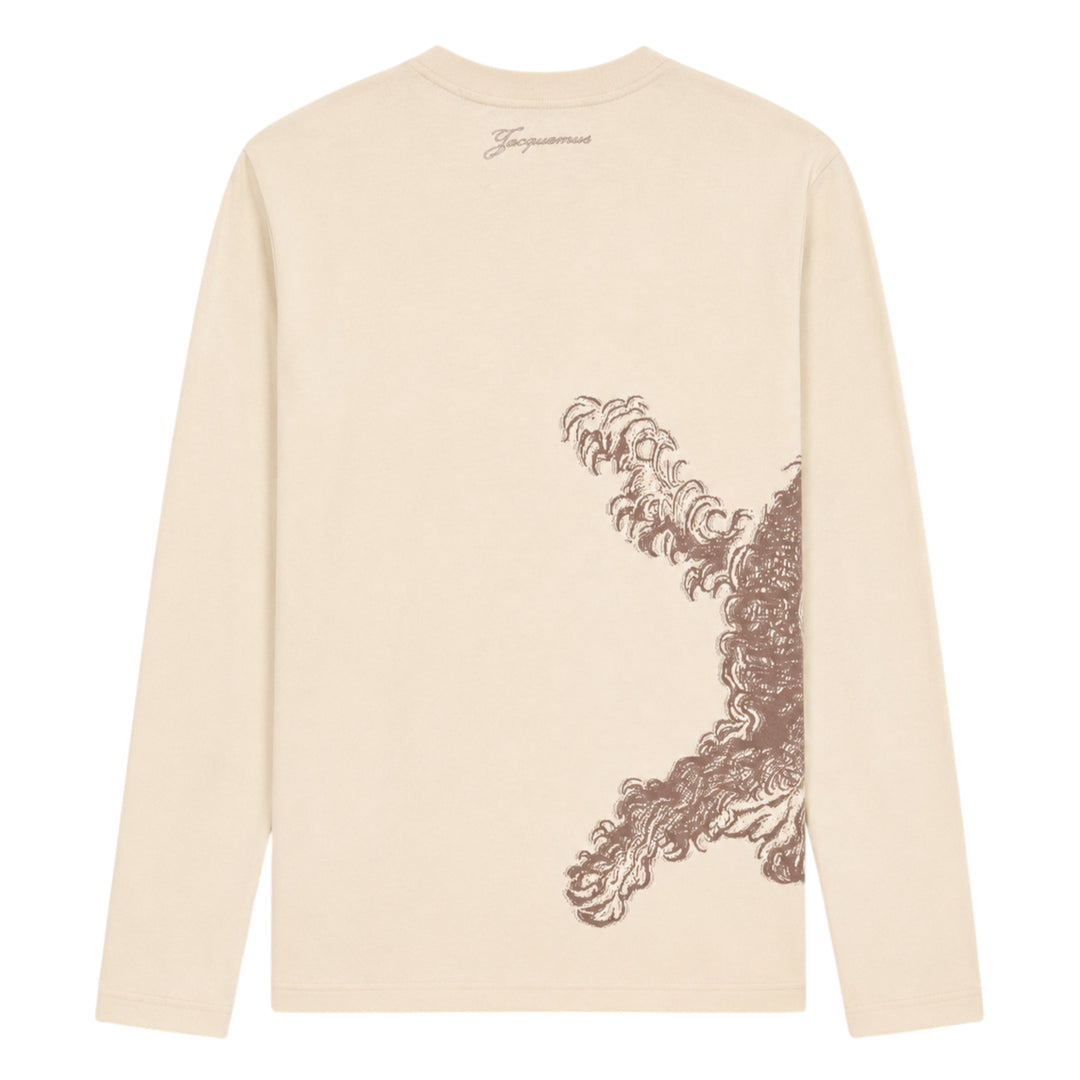 Jacquemus Le T-Shirt Bichon in ecru — long-sleeve crew-neck tee featuring a tonal brown hand-drawn curly dog illustration with a varsity number bib and cursive Jacquemus script across the front - view 2