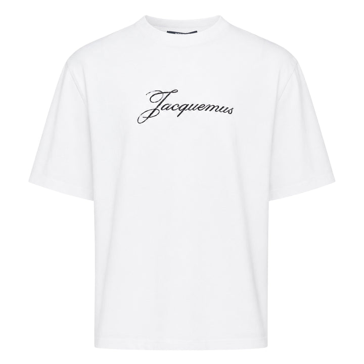 Jacquemus white oversized crew neck tee with distressed cursive Jacquemus script logo print across the chest