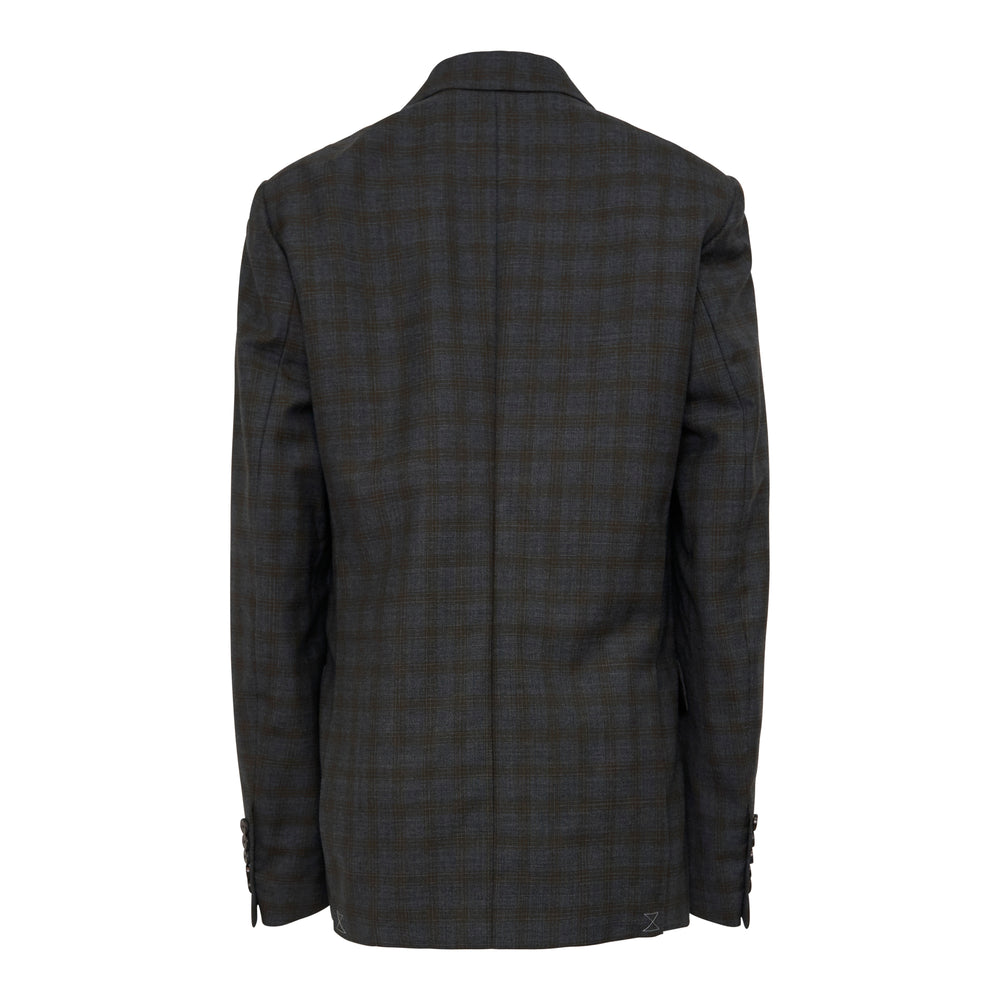 Dries Van Noten double-breasted blazer in dark glen plaid with peak lapels, six-button front, and hip flap pockets on a white background