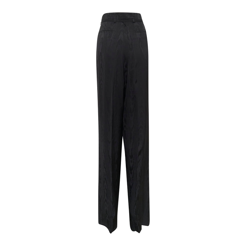 Dries Van Noten black moiré high-waisted wide-leg trousers with front pleats and metal waistband hardware, displayed flat on a white background - view 2