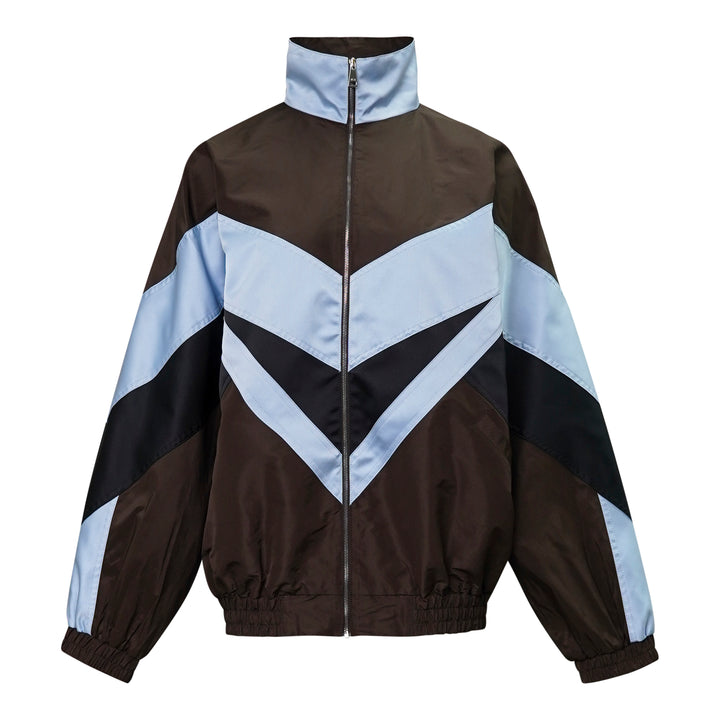 N°21 oversized sports blouson in dark brown and powder blue with bold navy chevron colourblock panels, funnel neck, and full-length zip closure