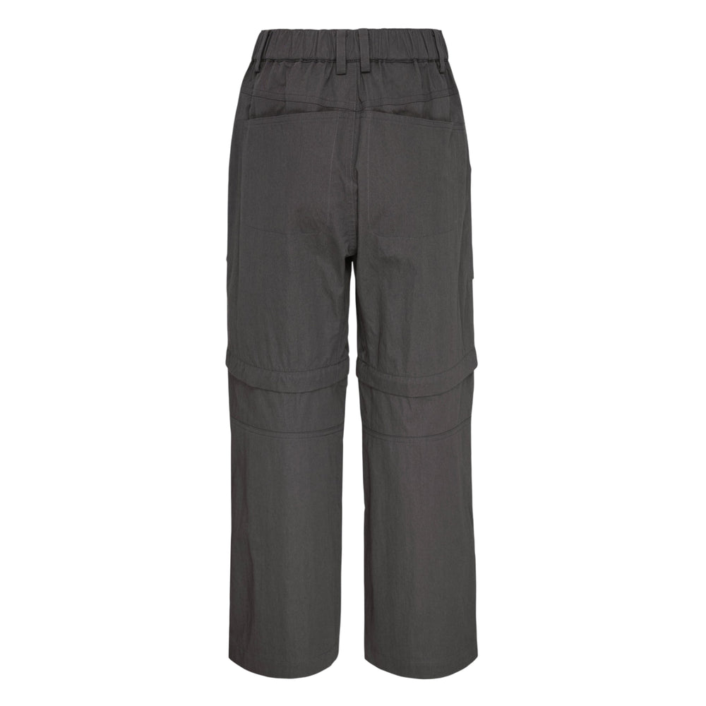 Ordinary Couture Code two-way convertible cargo pants in charcoal grey with zip-off lower legs, thigh cargo pockets, and tonal branding print