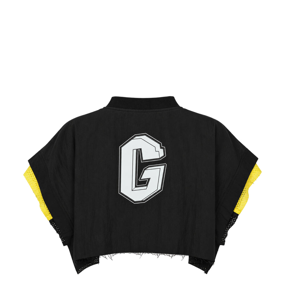 Ordinary Couture Code Layered Crop Top in black with neon yellow mesh underlayer visible at the V-neckline and sleeves, featuring a boxy silhouette and ribbed neckline trim, flat lay on white background